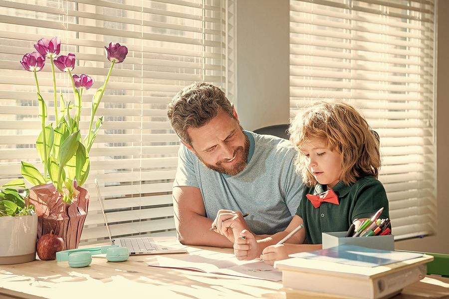 Dad and son happy homeschooling create a school-life balance for your homeschooler