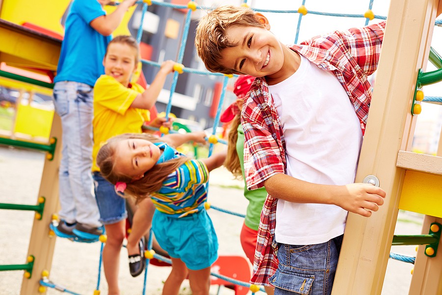 Homeschooled children playing together on a playground fostering social skills