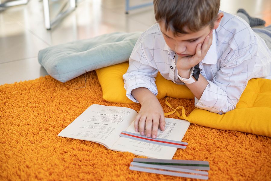 Homeschooling students with dyslexia child utilizing learning tool