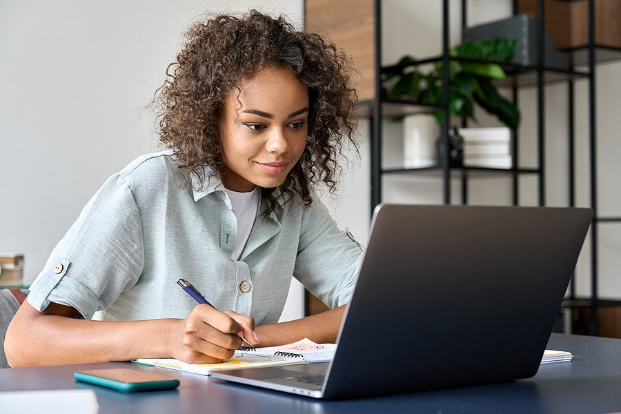 A high school girl homeschooling fosters independence through her personal studies.