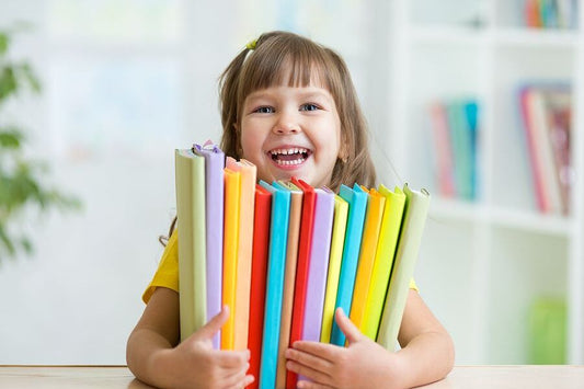 Homeschooling gifted children girl holding books love of learning