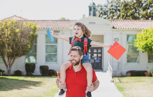Father and son with backpack excited about homeschooling