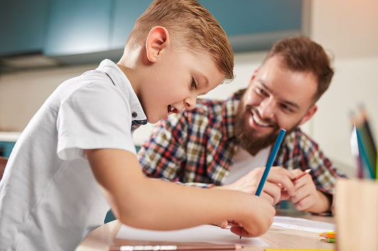 Parent helping son with homework transition to homeschooling