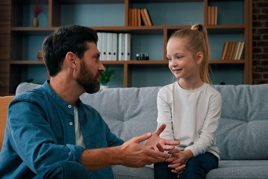 Dad talking with young daughter introduce idea of homeschooling