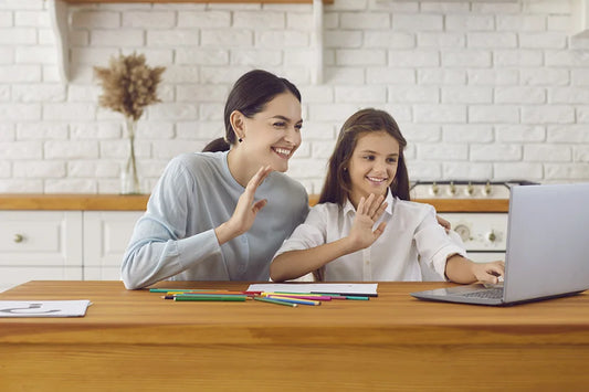 A mom and her daughter using provided resources to make homeschooling possible.