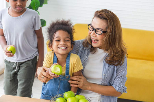 Homeschool resources kids eating healthy snacks at home with mom school work break